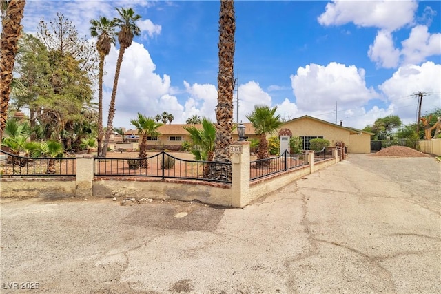 4678 Saddle Pl, Las Vegas, NV 89119 - view of front facade with a fenced front yard and stucco siding