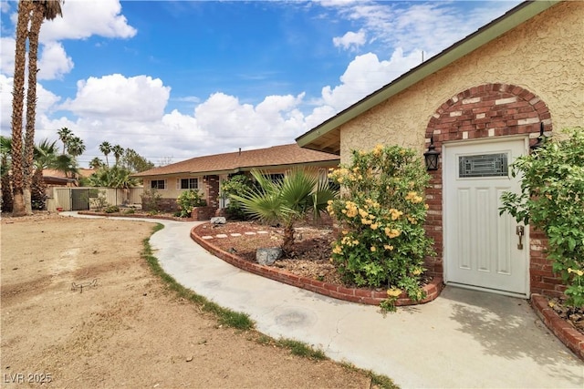 4678 Saddle Pl, Las Vegas, NV 89119 - view of front of house with brick siding and stucco siding