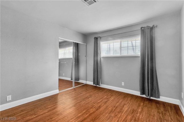 4678 Saddle Pl, Las Vegas, NV 89119 - unfurnished bedroom with wood finished floors, baseboards, and a closet