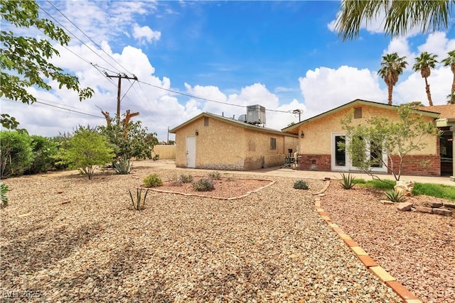 4678 Saddle Pl, Las Vegas, NV 89119 - back of property with brick siding, stucco siding, and a patio area