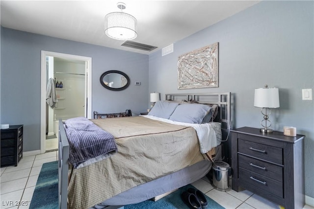 4678 Saddle Pl, Las Vegas, NV 89119 - bedroom featuring light tile patterned flooring, ensuite bath, and baseboards