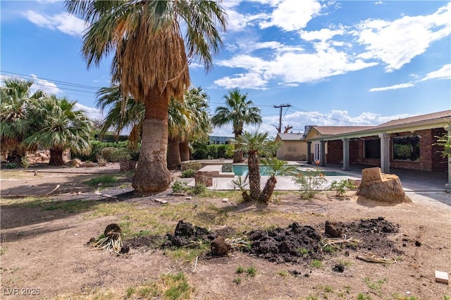 4678 Saddle Pl, Las Vegas, NV 89119 - view of yard featuring an outdoor pool and a patio