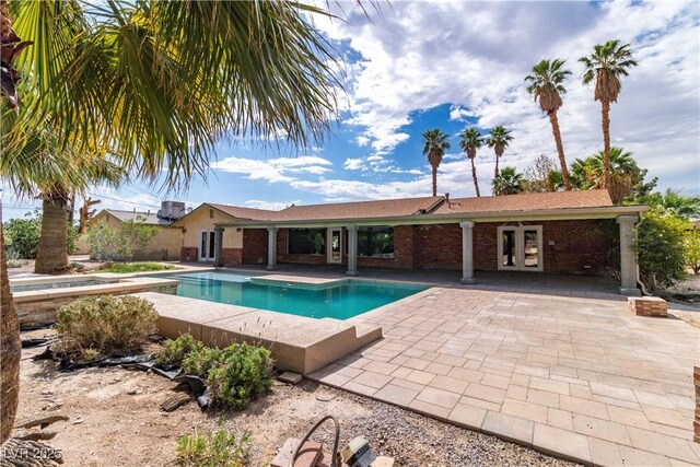 4678 Saddle Pl, Las Vegas, NV 89119 - swimming pool featuring a patio, french doors, and a hot tub