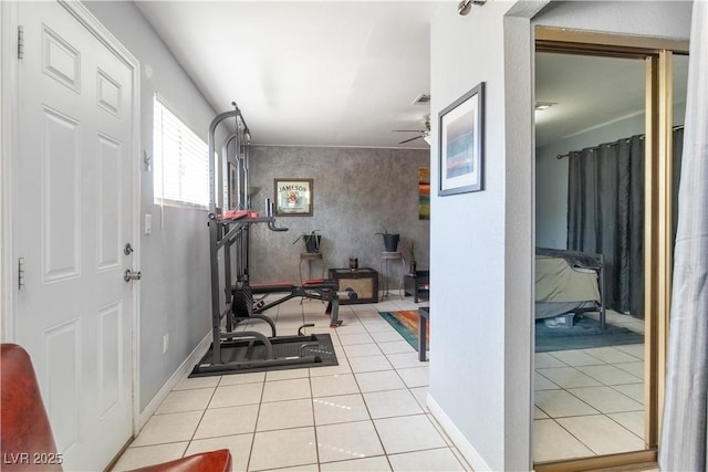 4678 Saddle Pl, Las Vegas, NV 89119 - workout area with a ceiling fan and tile patterned floors