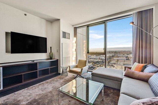 4381 W Flamingo Rd Unit 1609, Las Vegas, NV 89103 - carpeted living room featuring floor to ceiling windows and visible vents