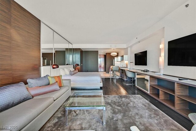 4381 W Flamingo Rd Unit 1609, Las Vegas, NV 89103 - living area featuring dark wood-style flooring