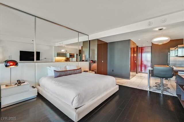 4381 W Flamingo Rd Unit 1609, Las Vegas, NV 89103 - bedroom featuring wood finished floors