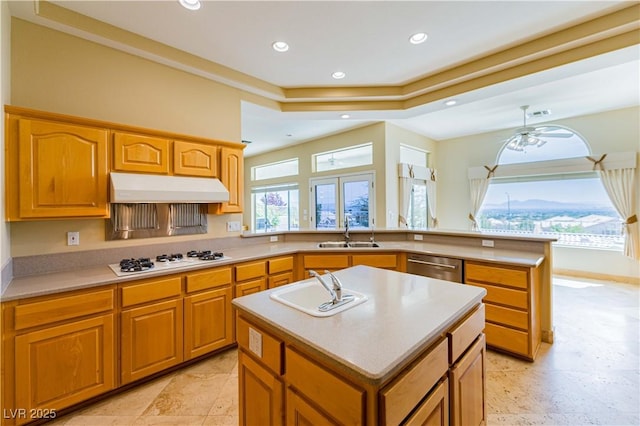 2212 Sierra Heights Dr, Las Vegas, NV 89134 - kitchen featuring white gas cooktop, a peninsula, under cabinet range hood, a sink, and stainless steel dishwasher