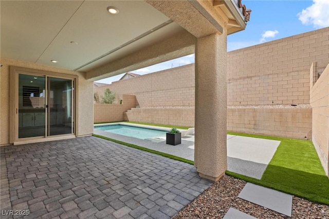 view of patio / terrace featuring a fenced backyard and a fenced in pool