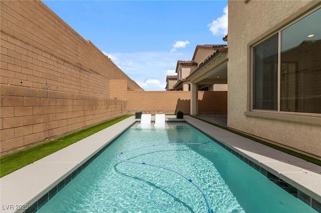 view of pool featuring a fenced in pool and a fenced backyard