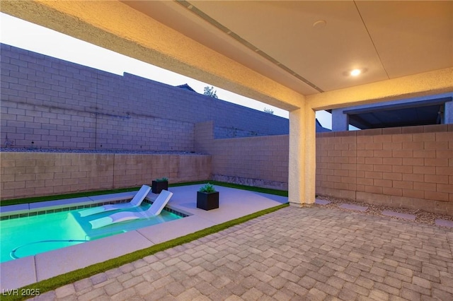 view of pool with a patio area, a fenced backyard, and a fenced in pool