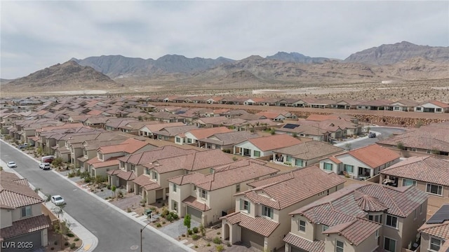 birds eye view of property with a residential view and a mountain view