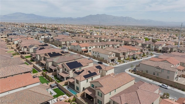 drone / aerial view with a residential view and a mountain view