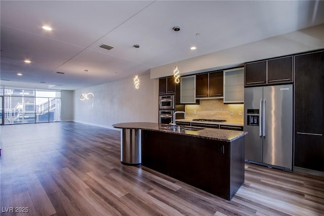 8925 W Flamingo Rd Unit 228, Las Vegas, NV 89147 - kitchen featuring high quality fridge, a sink, dark wood finished floors, visible vents, and decorative backsplash
