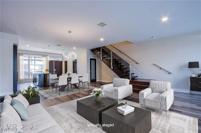 8925 W Flamingo Rd Unit 228, Las Vegas, NV 89147 - living room featuring recessed lighting, baseboards, stairs, and wood finished floors