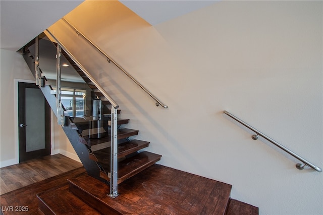8925 W Flamingo Rd Unit 228, Las Vegas, NV 89147 - stairway featuring baseboards and wood finished floors
