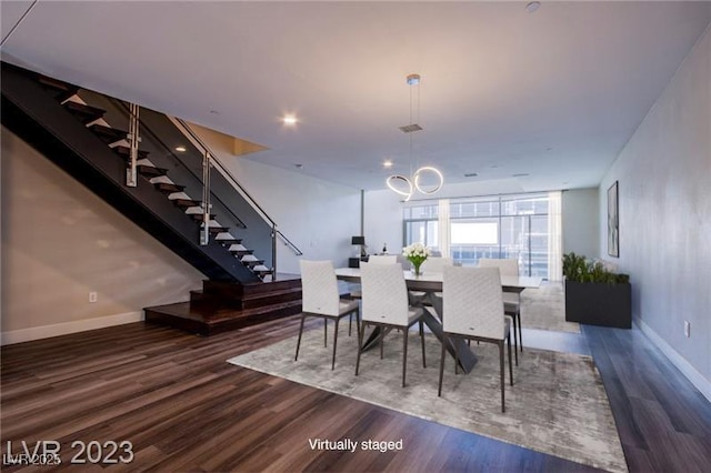 8925 W Flamingo Rd Unit 228, Las Vegas, NV 89147 - dining area with stairs, baseboards, floor to ceiling windows, a notable chandelier, and wood finished floors