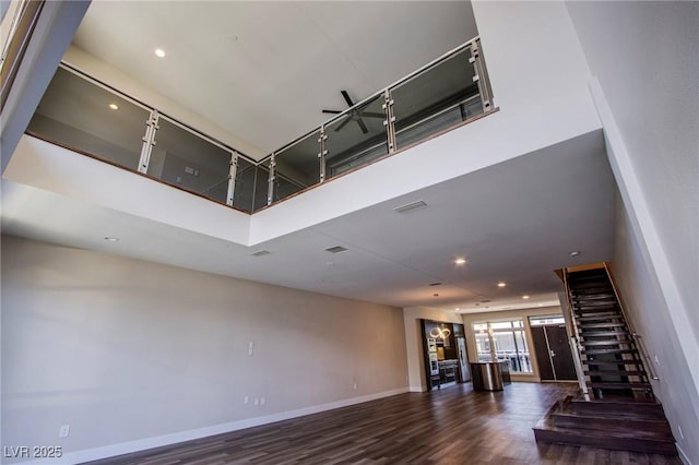 8925 W Flamingo Rd Unit 228, Las Vegas, NV 89147 - interior space with baseboards, visible vents, a towering ceiling, and wood finished floors