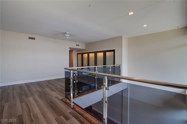 8925 W Flamingo Rd Unit 228, Las Vegas, NV 89147 - hall with an upstairs landing, recessed lighting, baseboards, visible vents, and wood finished floors