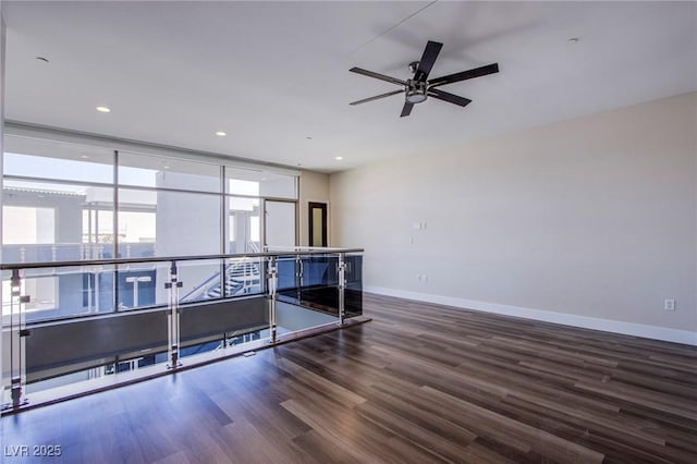 8925 W Flamingo Rd Unit 228, Las Vegas, NV 89147 - empty room featuring baseboards, ceiling fan, wood finished floors, and recessed lighting