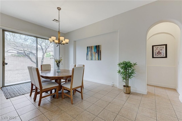 dining area with a chandelier, visible vents, baseboards, and light tile patterned flooring