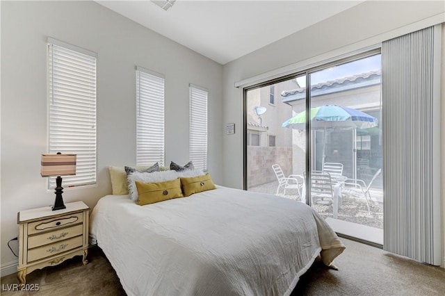 bedroom featuring dark carpet and access to outside