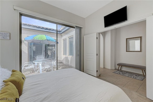 bedroom featuring baseboards, access to outside, and tile patterned flooring