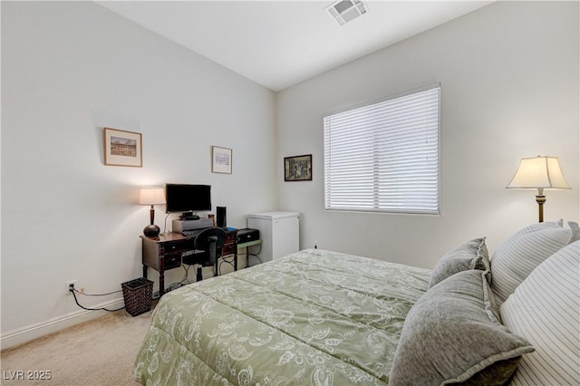 carpeted bedroom with visible vents and baseboards