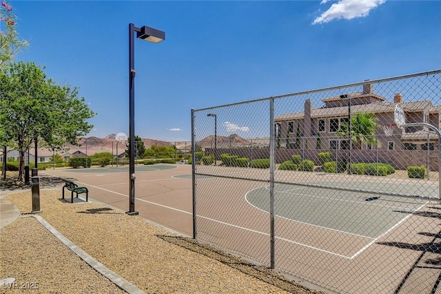 view of sport court featuring community basketball court and fence
