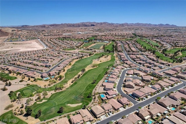 aerial view featuring a residential view, golf course view, and a mountain view