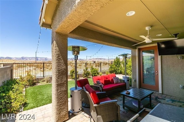 view of patio / terrace featuring a fenced backyard, ceiling fan, and outdoor lounge area