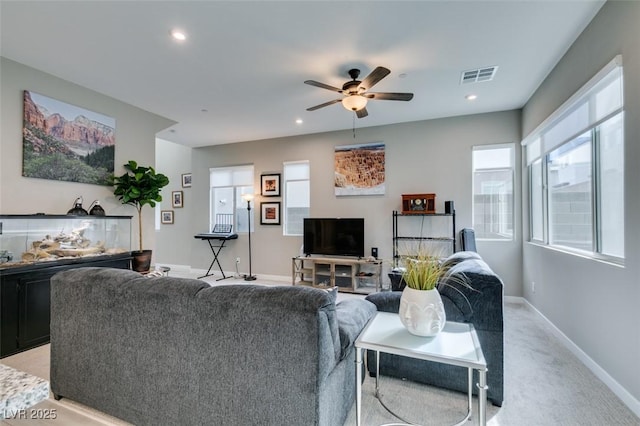 living area with light carpet, a ceiling fan, baseboards, recessed lighting, and visible vents