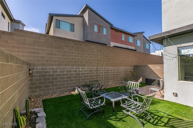 view of yard with a fenced backyard