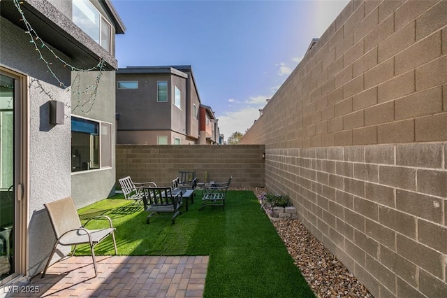 view of yard featuring a fenced backyard and a patio area