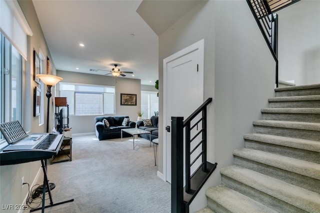stairway with a ceiling fan, baseboards, recessed lighting, and carpet