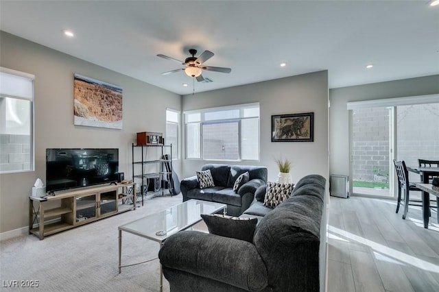 living area with plenty of natural light, baseboards, ceiling fan, and recessed lighting