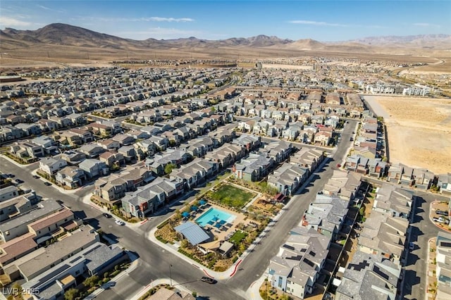 drone / aerial view featuring a residential view and a mountain view