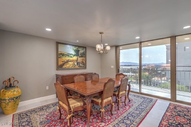 dining area with floor to ceiling windows, plenty of natural light, light tile patterned flooring, and an inviting chandelier