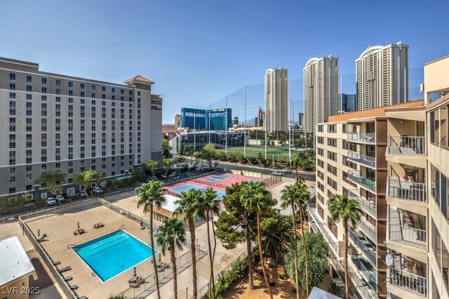 view of pool featuring a city view