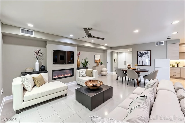 205 E Harmon Ave Unit 1007, Las Vegas, NV 89169 - living area with a ceiling fan, recessed lighting, and a glass covered fireplace