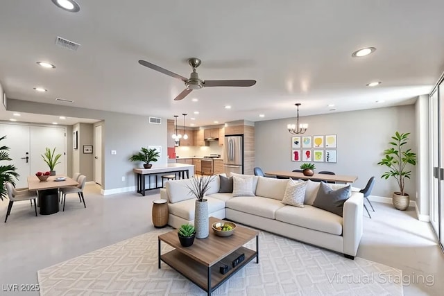 205 E Harmon Ave Unit 1007, Las Vegas, NV 89169 - living room with recessed lighting, a chandelier, a ceiling fan, and concrete flooring