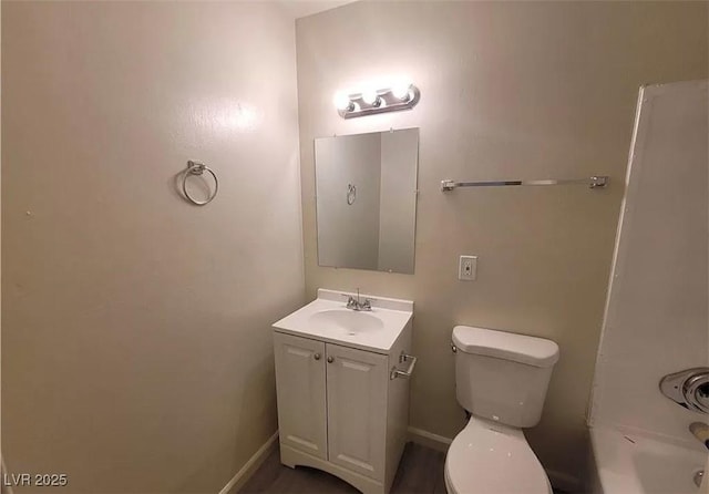 3749 Ponderosa Ave, Las Vegas, NV 89115 - full bathroom featuring toilet, vanity, and baseboards