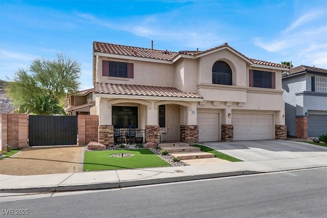 view of front of home with stucco siding, driveway, stone siding, a garage, and a gate