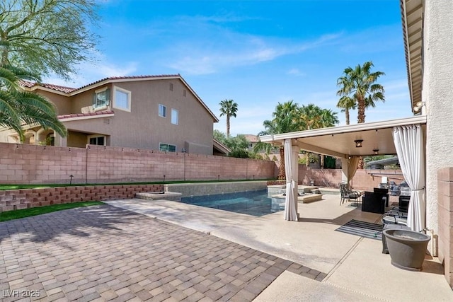 view of patio with a fenced in pool and a fenced backyard
