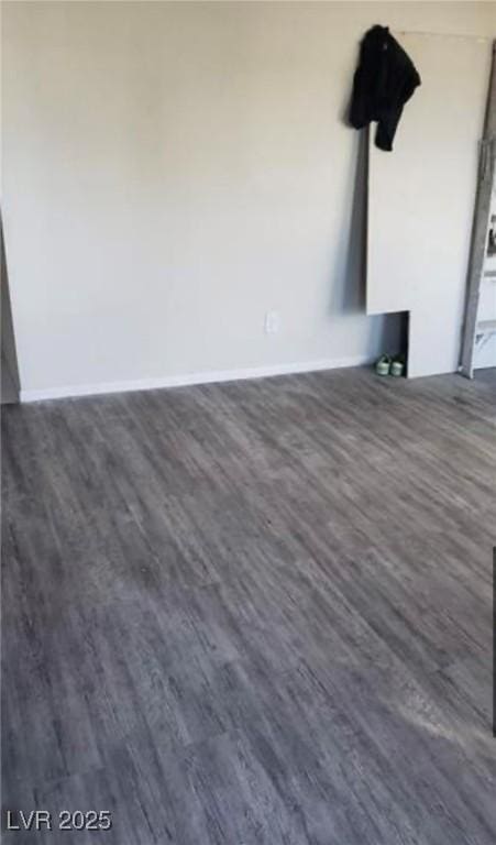 3711 Southern Light Dr, Las Vegas, NV 89115 - room details featuring baseboards and wood finished floors