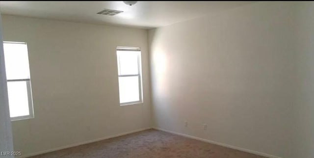 3883 Winter Whitetail St, Las Vegas, NV 89122 - unfurnished room featuring baseboards, visible vents, light carpet, and plenty of natural light