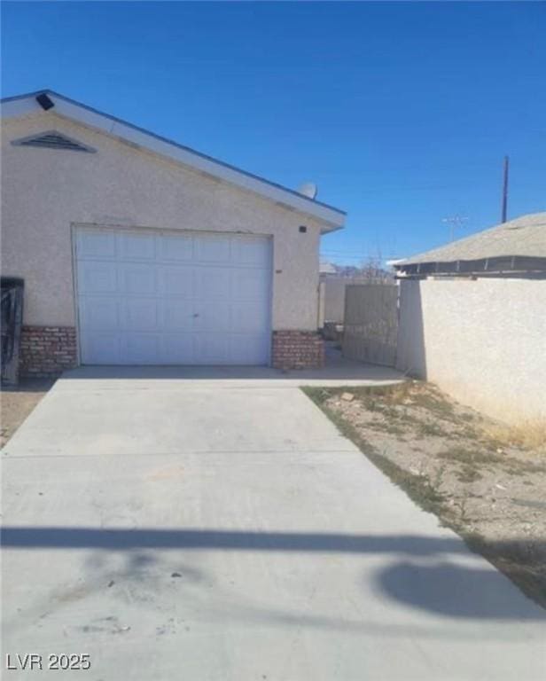 664 Sky Rd, Indian Springs, NV 89018 - garage featuring driveway