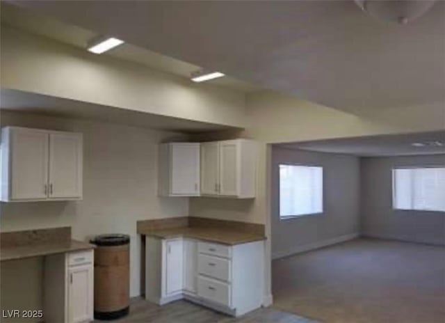 664 Sky Rd, Indian Springs, NV 89018 - kitchen with white cabinetry