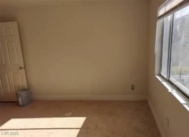 664 Sky Rd, Indian Springs, NV 89018 - unfurnished room featuring baseboards and light colored carpet