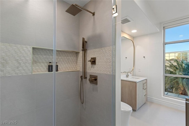 full bath with a shower stall, visible vents, toilet, and vanity